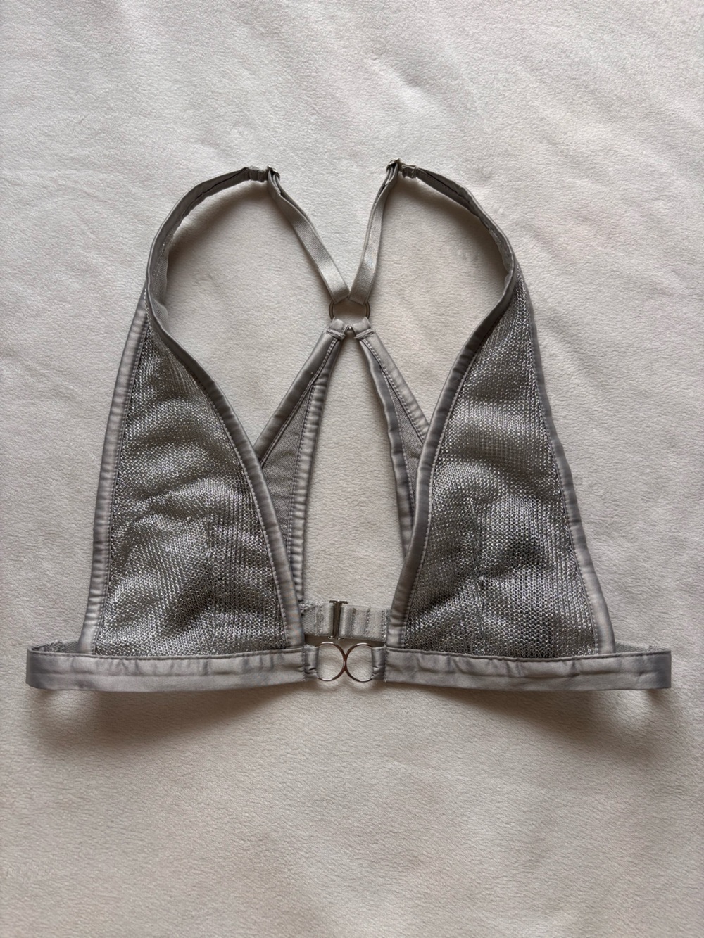 Victoria’s Secret Sheer shimmery silver bralette with circular details, size XS